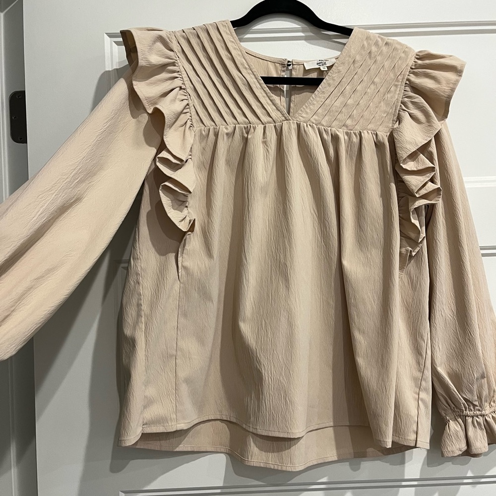 Womens cream long sleeve blouse.
